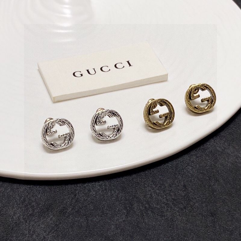 G*u*i earrings